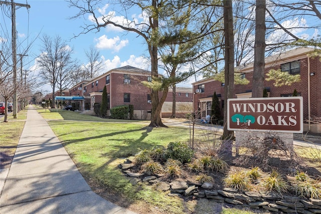 view of property's community with a lawn