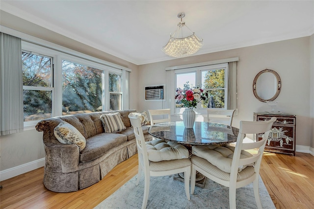 dining room featuring a chandelier and light hardwood / wood-style flooring