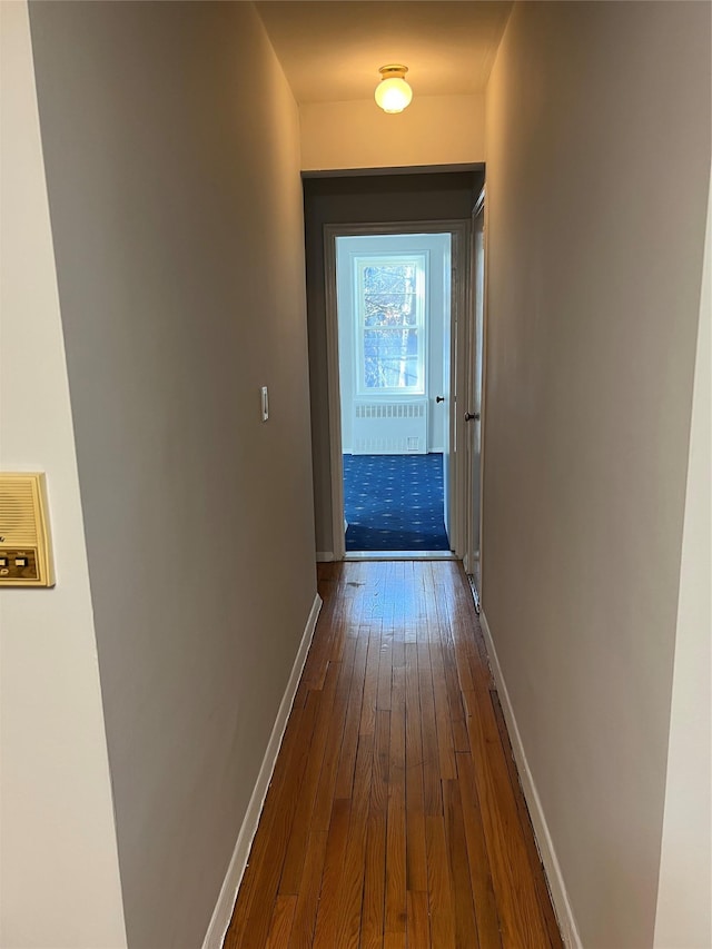 corridor featuring hardwood / wood-style flooring