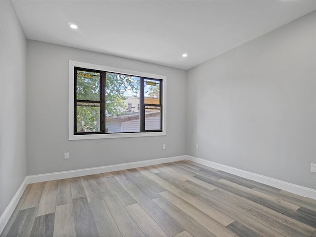 unfurnished room featuring light hardwood / wood-style floors