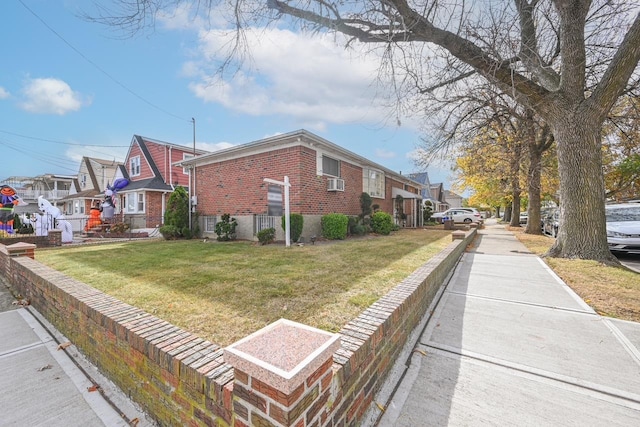 view of side of property featuring a lawn