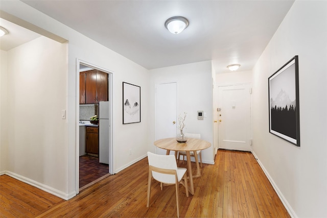 dining space with light wood-type flooring