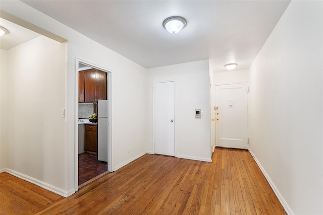 corridor featuring light hardwood / wood-style flooring