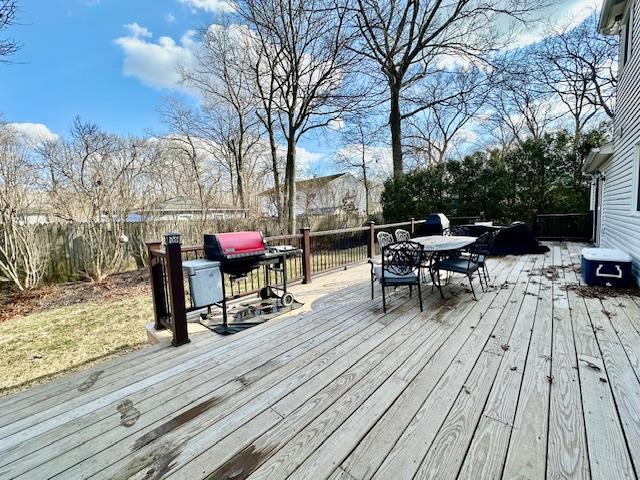 wooden terrace with area for grilling