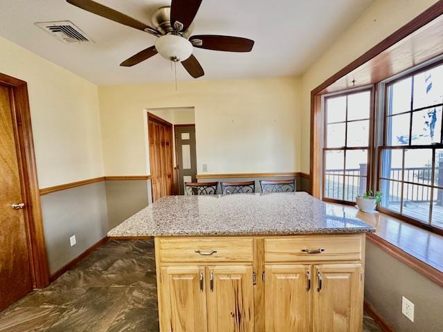 kitchen featuring ceiling fan