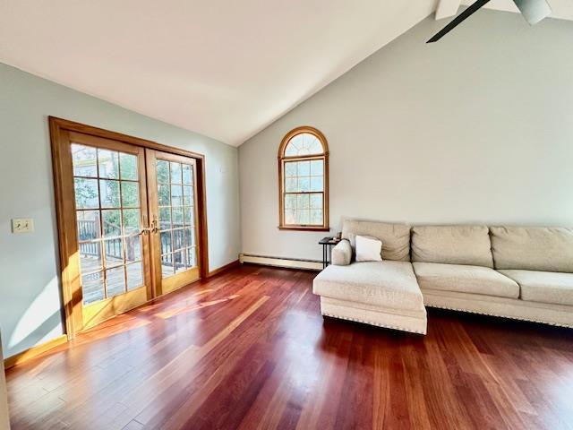 living room featuring a baseboard radiator, high vaulted ceiling, dark hardwood / wood-style flooring, and french doors