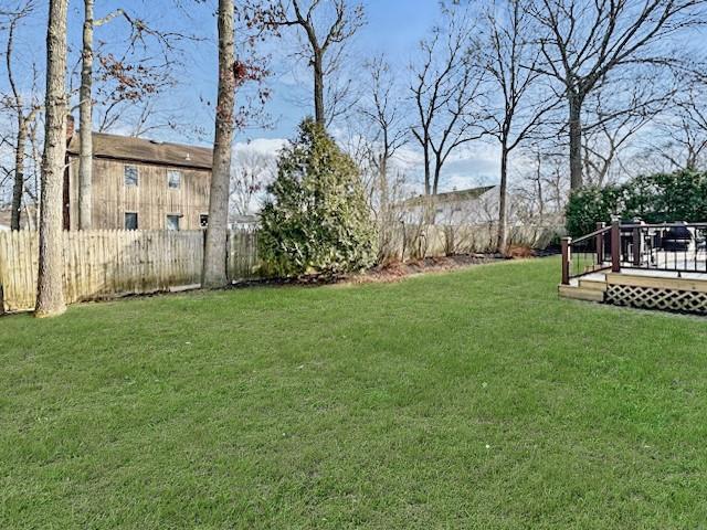 view of yard with a wooden deck