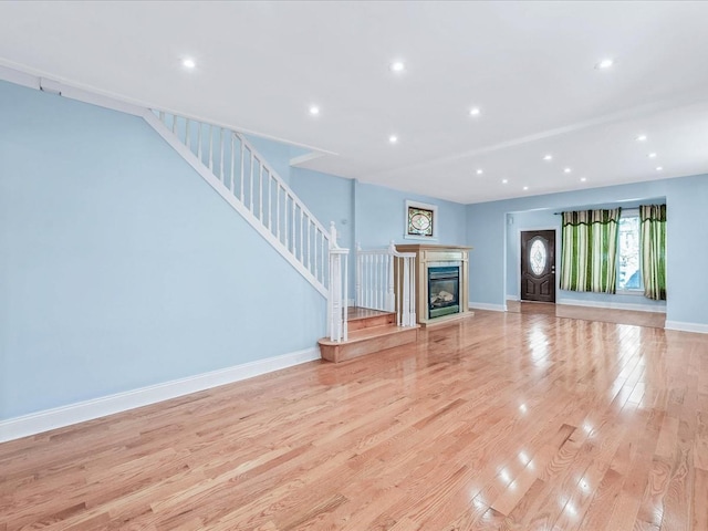 unfurnished living room featuring light hardwood / wood-style floors