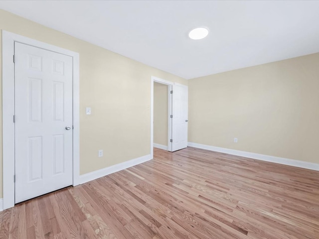 spare room featuring light hardwood / wood-style floors