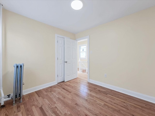 spare room featuring light hardwood / wood-style flooring