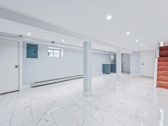 basement with electric panel and a baseboard heating unit