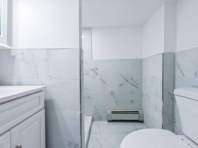 bathroom with a baseboard radiator, a shower, tile walls, vanity, and toilet