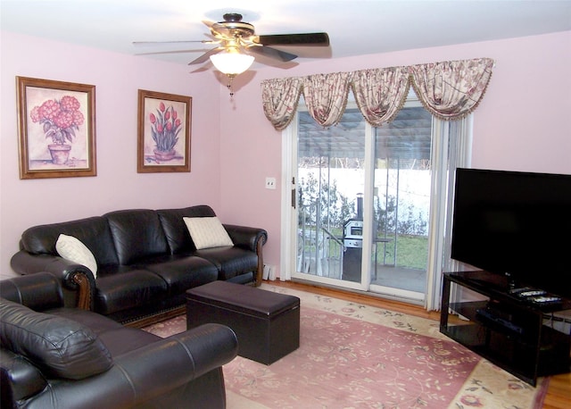 living room with hardwood / wood-style flooring and ceiling fan