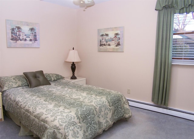 carpeted bedroom featuring baseboard heating