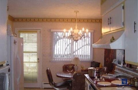 dining area featuring an inviting chandelier