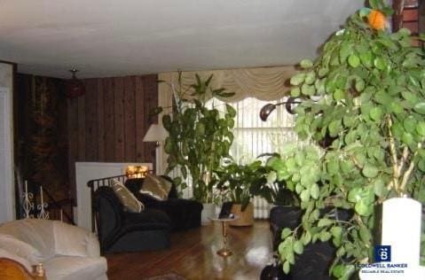 living room featuring wooden walls