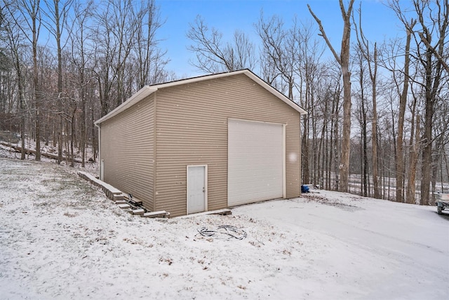 view of snow covered garage