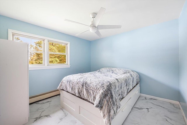 bedroom featuring ceiling fan and a baseboard heating unit