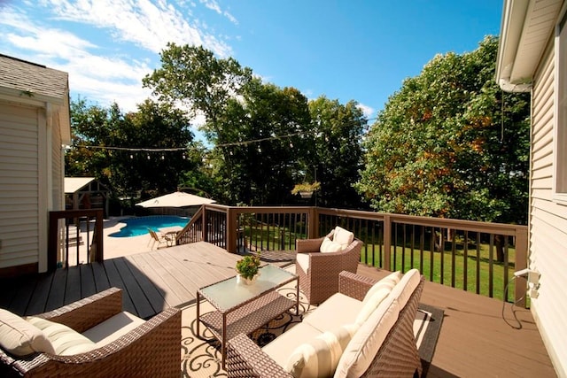 wooden terrace featuring an outdoor pool and outdoor lounge area