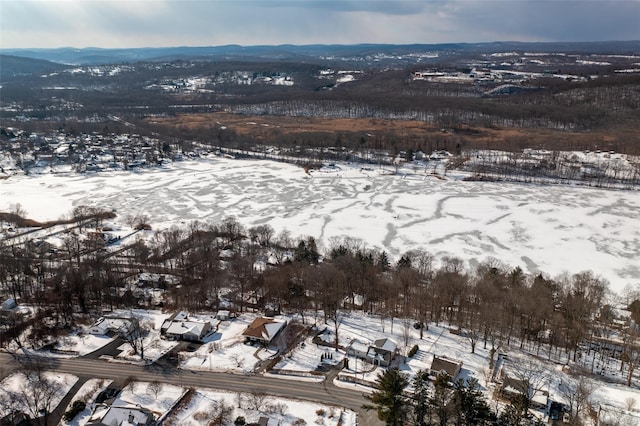 snowy aerial view with a mountain view