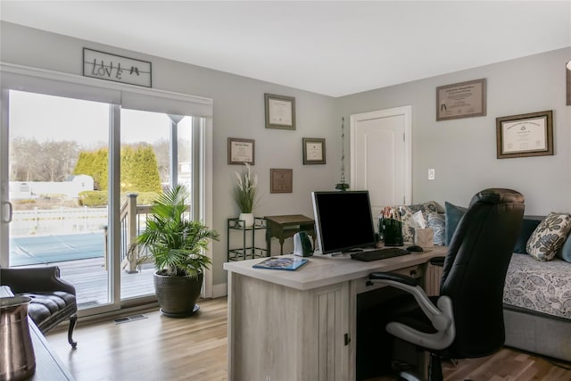 home office featuring light hardwood / wood-style flooring