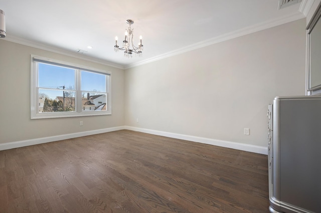 unfurnished dining area featuring crown molding, dark hardwood / wood-style flooring, and an inviting chandelier