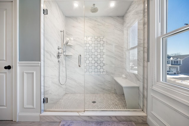 bathroom with a shower with shower door