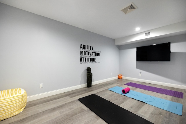 exercise area with wood-type flooring