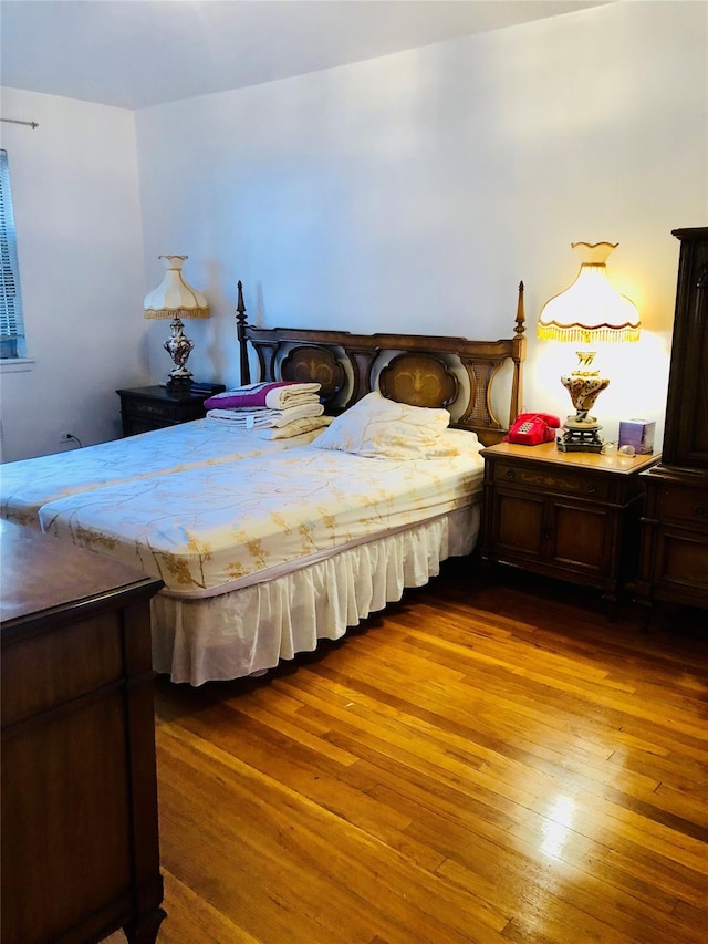 bedroom featuring wood-type flooring