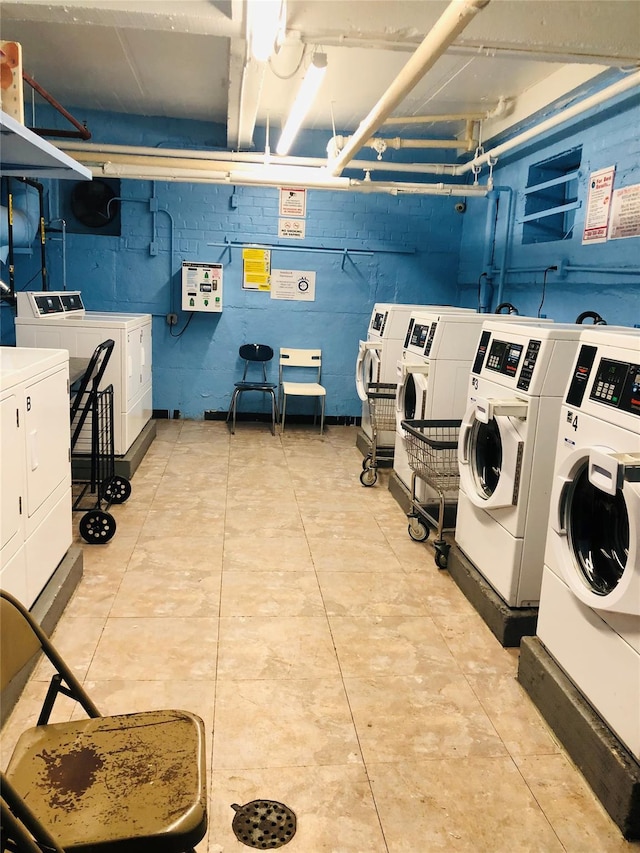 shared laundry area featuring washing machine and clothes dryer