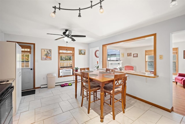 dining area with cooling unit, track lighting, ceiling fan, and light tile patterned floors