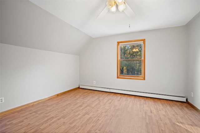 bonus room featuring baseboard heating, ceiling fan, vaulted ceiling, and light hardwood / wood-style flooring