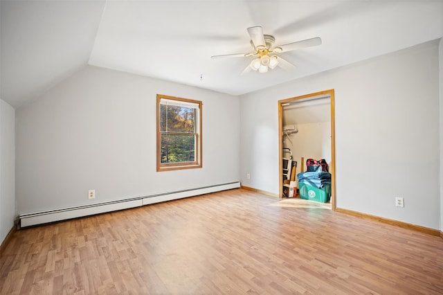 bonus room featuring vaulted ceiling, light wood-type flooring, ceiling fan, and baseboard heating