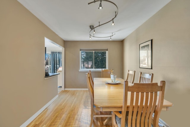 dining area with light hardwood / wood-style floors