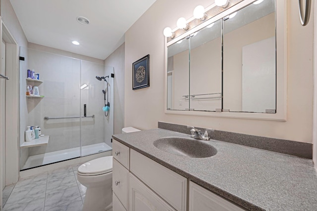 bathroom with vanity, toilet, and an enclosed shower