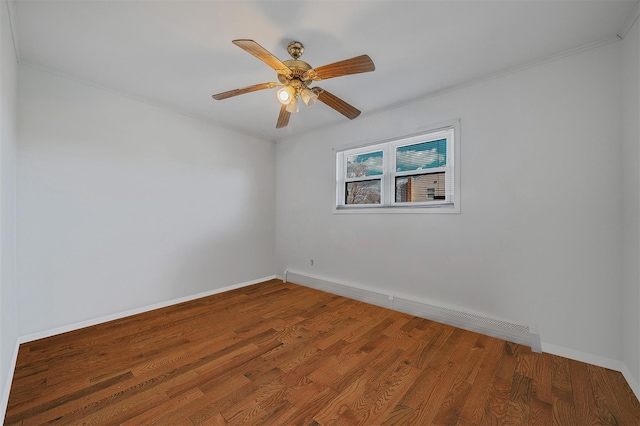 unfurnished room with ceiling fan, wood-type flooring, and a baseboard radiator