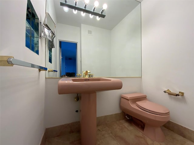 bathroom featuring tile patterned floors and toilet