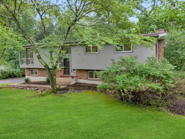 3 Dore Ct, New City, NY 10956 - rear view of house featuring a yard, a chimney, and brick siding