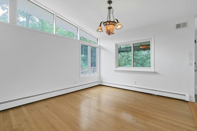 3 Dore Ct, New City, NY 10956 - spare room with a chandelier, wood finished floors, and a baseboard radiator