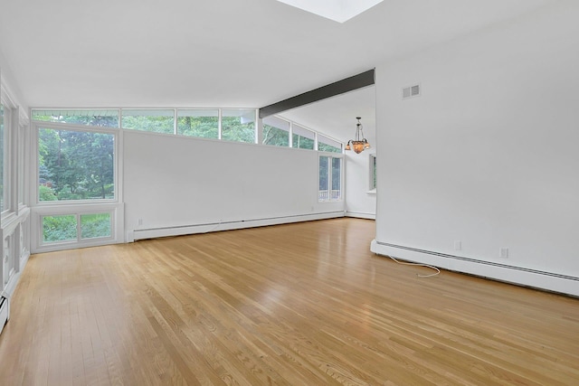 3 Dore Ct, New City, NY 10956 - unfurnished room featuring a baseboard radiator, light wood-style floors, and plenty of natural light