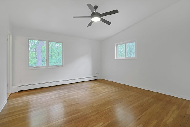 3 Dore Ct, New City, NY 10956 - empty room featuring a baseboard heating unit, vaulted ceiling, light wood-style floors, and a ceiling fan