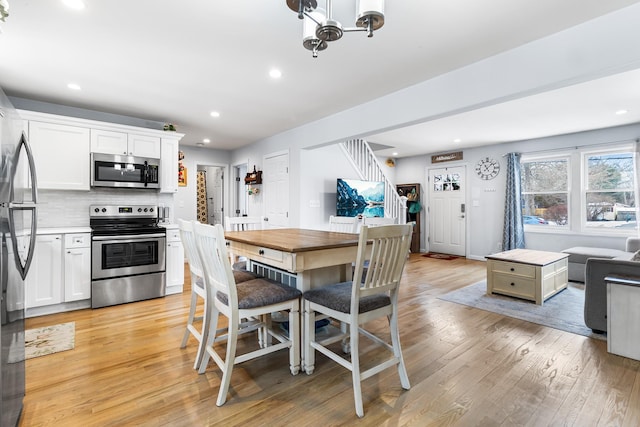 dining area featuring light wood-type flooring