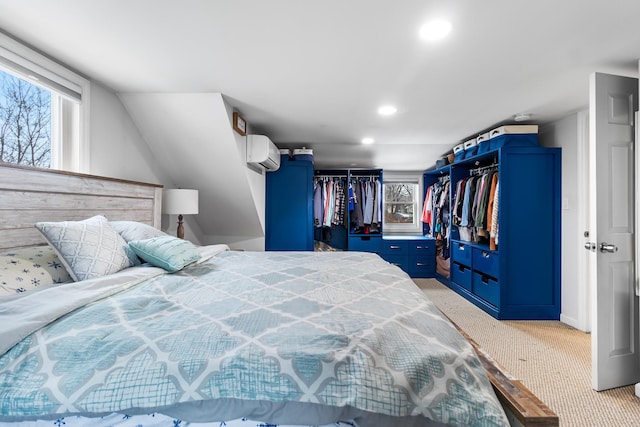 carpeted bedroom with an AC wall unit