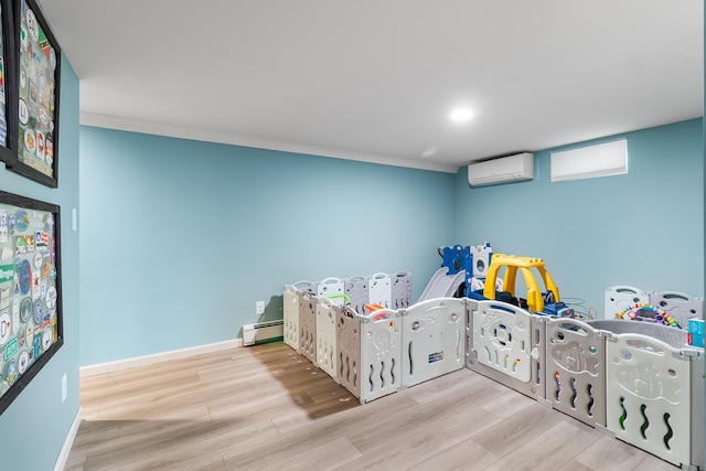 bedroom with crown molding, a baseboard radiator, a wall mounted AC, and light wood-type flooring