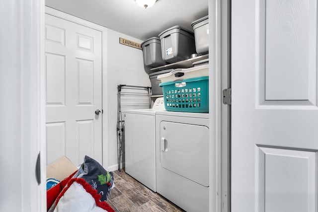 clothes washing area featuring washer and clothes dryer