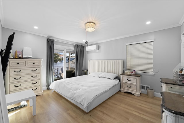 bedroom featuring crown molding, an AC wall unit, access to exterior, and light hardwood / wood-style flooring