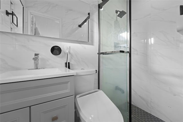 bathroom featuring vanity, tile walls, toilet, and walk in shower