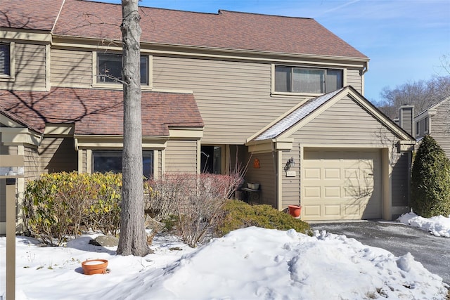 view of front of house featuring roof with shingles