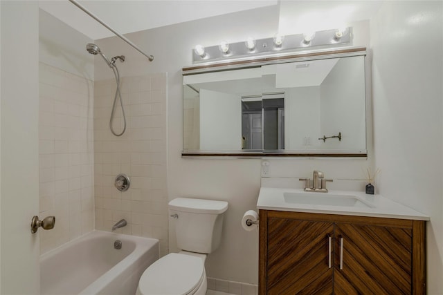 full bathroom featuring vanity, toilet, and tiled shower / bath