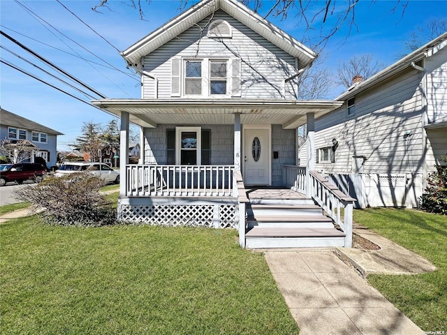 view of front of house with a porch and a front yard